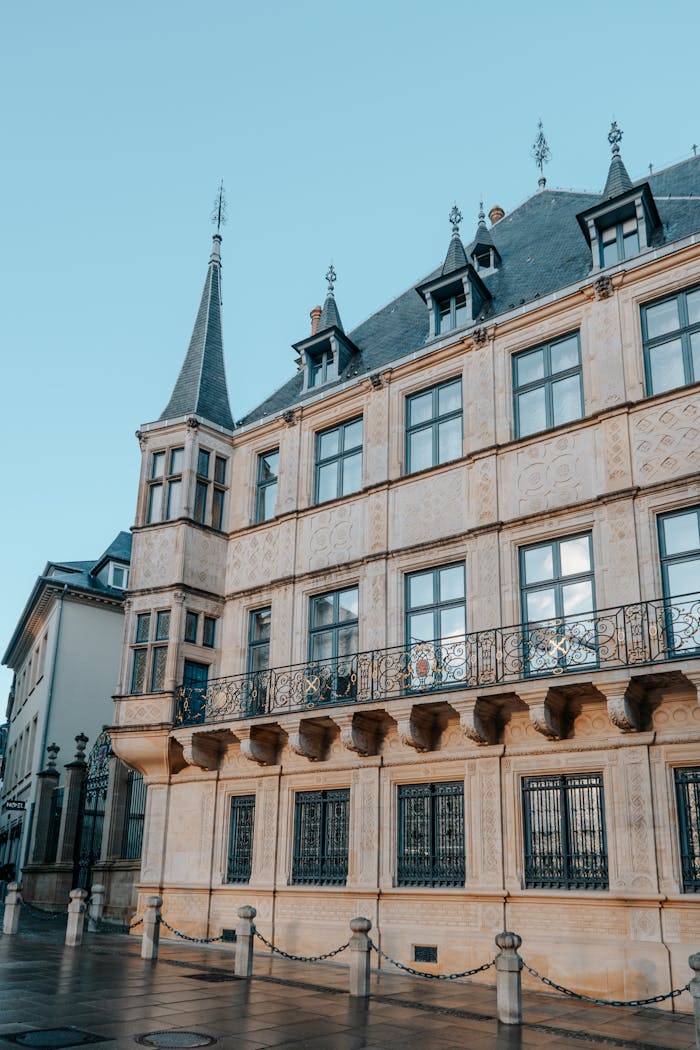 Explore a historic gothic building with intricate facades and spires in a serene city setting.